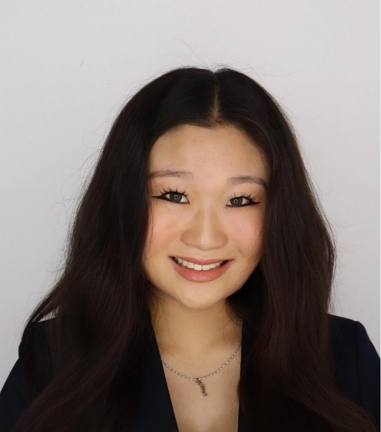 Stephanie Leung smiling against a plain white backdrop